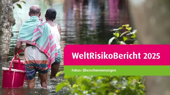 Two people stand in the floodwaters, the cover of the World Risk Report