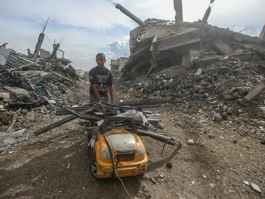 Scrap collectors in the rubble of Gaza